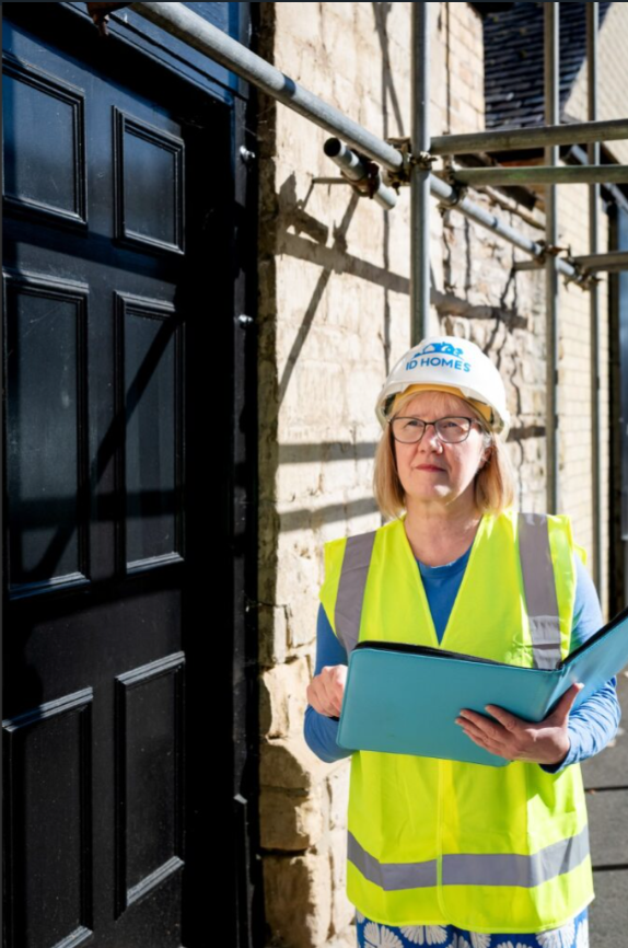 ID Stays team member on site in hi-vis and hard hat